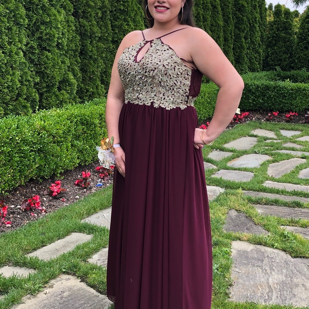 Dress size 15 in new condition.